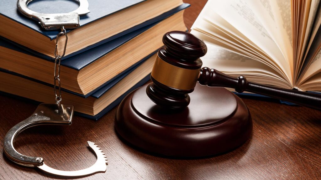 Gavel near stacks of books