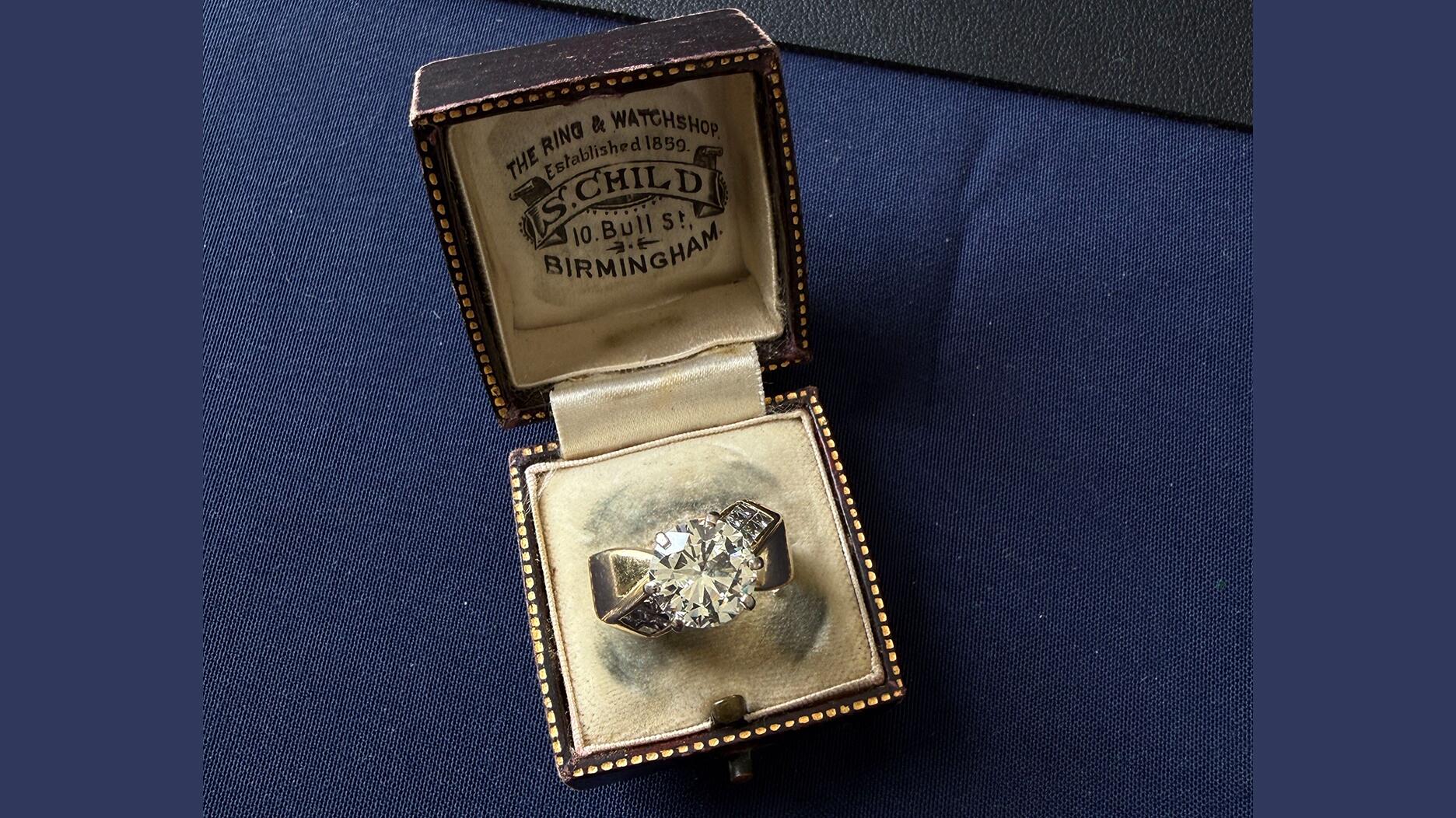 A diamond ring in a jewelry box