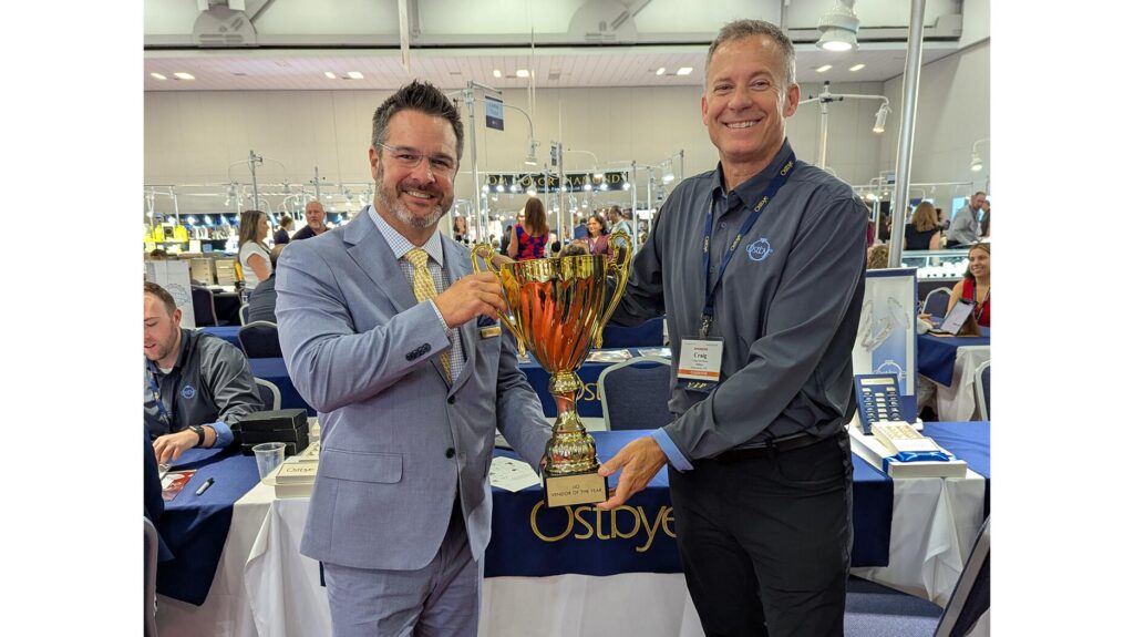 Ostbye receiving Vendor of the Year trophy at 2026 IJO show
